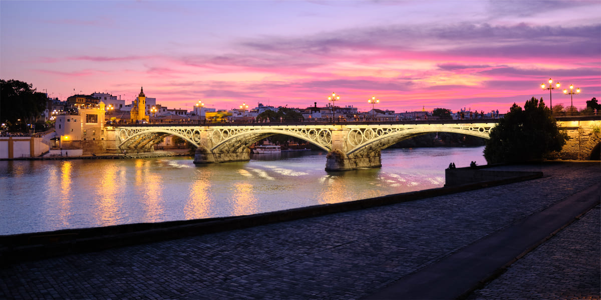 triana bridge in seville spain at sunset 2021 08 27 10 14 48 utc